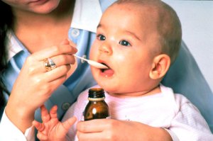 Baby swallowing medicine